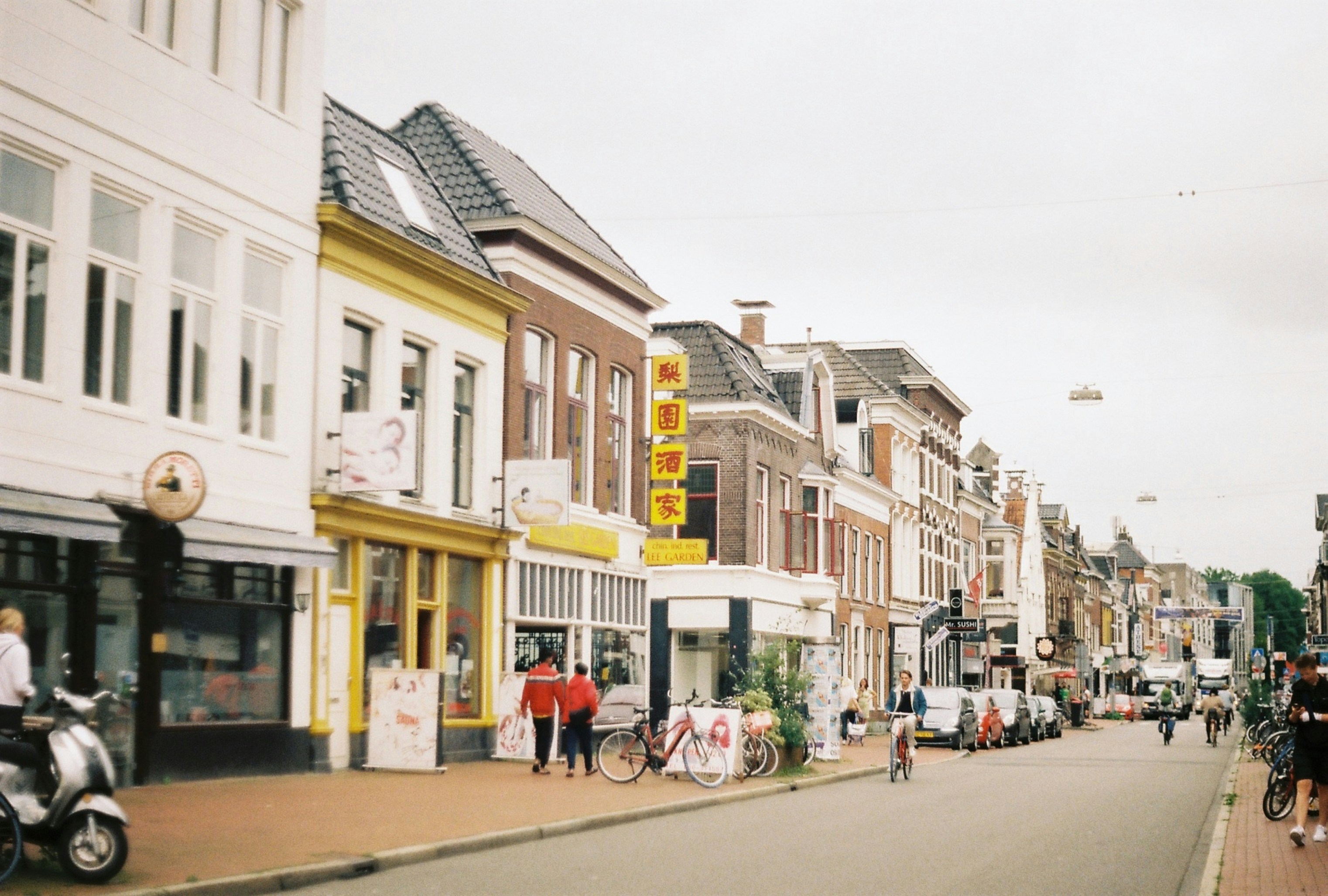 a street with buildings and people